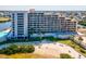 A multi-story condo with waterfront access to a sandy beach and swimming pool for residents' leisure at 6035 Sea Ranch Dr # 209, Hudson, FL 34667