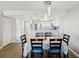 Open concept dining room with sleek pendant lighting next to the kitchen, ideal for entertaining at 6035 Sea Ranch Dr # 209, Hudson, FL 34667