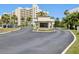 The entrance is a security booth, with a road leading to the condo building ahead at 6035 Sea Ranch Dr # 209, Hudson, FL 34667