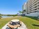 This property has picnic tables on the beautiful lush green lawn for relaxing and enjoying the outdoors at 6035 Sea Ranch Dr # 209, Hudson, FL 34667