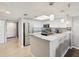 Elegant kitchen featuring stainless steel appliances, breakfast bar, and stylish countertops at 6035 Sea Ranch Dr # 209, Hudson, FL 34667