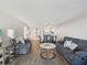 Open-concept living space flows into the dining area, showcasing modern finishes and a welcoming layout at 6035 Sea Ranch Dr # 209, Hudson, FL 34667