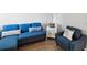 Comfortable living room with modern sofa, chair and stylish decor at 6035 Sea Ranch Dr # 209, Hudson, FL 34667