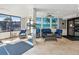 Welcoming condo lobby featuring comfortable seating, elegant decor, and abundant natural light through large windows at 6035 Sea Ranch Dr # 209, Hudson, FL 34667