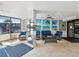 Bright and welcoming condo lobby with comfortable seating and a view of the exterior, perfect for residents and guests at 6035 Sea Ranch Dr # 209, Hudson, FL 34667