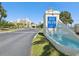 Gulf Island Beach & Tennis Club sign with a fountain and a view of the condos in the background at 6035 Sea Ranch Dr # 209, Hudson, FL 34667