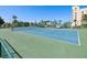 Well-maintained outdoor tennis court with green and blue surface within community at 6035 Sea Ranch Dr # 209, Hudson, FL 34667
