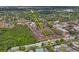An aerial view showcases the layout of this community with mature trees near the university at 6047 Elmhurst Dr # 5A, New Port Richey, FL 34653