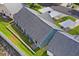 Aerial view of the home's backyard, landscaping, and surrounding neighborhood at 6047 Elmhurst Dr # 5A, New Port Richey, FL 34653