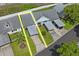 Aerial shot showcasing the home's landscaped yard, carport, and proximity to nearby properties in the neighborhood at 6047 Elmhurst Dr # 5A, New Port Richey, FL 34653