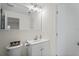 Clean bathroom featuring a modern vanity, a large mirror, and a toilet at 6047 Elmhurst Dr # 5A, New Port Richey, FL 34653