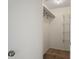 An empty walk-in closet with wire shelving and a hanging rod for ample storage at 6047 Elmhurst Dr # 5A, New Port Richey, FL 34653