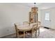 Cozy dining room with a china cabinet and a decorative light fixture provides an intimate setting at 6047 Elmhurst Dr # 5A, New Port Richey, FL 34653