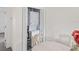A laundry closet with a stackable washer and dryer unit, located near a dining area at 6047 Elmhurst Dr # 5A, New Port Richey, FL 34653