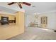 Open-concept living room and kitchen with modern appliances and a dining area provides ample space for entertaining at 6047 Elmhurst Dr # 5A, New Port Richey, FL 34653
