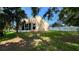 Expansive backyard offering ample green space and privacy at 6054 Merrifield Dr, Zephyrhills, FL 33541