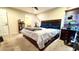 Spacious bedroom featuring a comfortable bed and a glimpse into the bathroom at 6054 Merrifield Dr, Zephyrhills, FL 33541