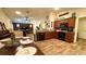 Open-concept living space with dining area, kitchen, and living room with vaulted ceiling at 6054 Merrifield Dr, Zephyrhills, FL 33541