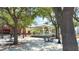 Picturesque town square with a gazebo, tables, and benches under the shade of mature trees, creating a welcoming ambiance at 6054 Merrifield Dr, Zephyrhills, FL 33541