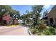 Charming town street lined with trees, featuring a 20 mph speed limit sign and brick-paved roadway at 6054 Merrifield Dr, Zephyrhills, FL 33541