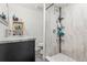 Modern bathroom with a sleek vanity, updated fixtures, and a luxurious walk-in shower at 6104 Cork Ct, New Port Richey, FL 34653