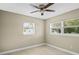 This bedroom is bright, airy, and has two windows at 6104 Cork Ct, New Port Richey, FL 34653