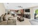Open living room featuring a gourmet kitchen with granite countertops and stainless steel appliances at 6104 Cork Ct, New Port Richey, FL 34653