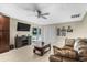 Living room with modern furnishings and a sliding glass door that leads to a swimming pool at 6104 Cork Ct, New Port Richey, FL 34653