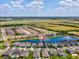Community aerial view featuring a home with a lake view and access to amenities, highlighted by a location pin at 6229 Sea Air Dr, Apollo Beach, FL 33572