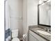 Bright bathroom with granite countertop, a sink, a toilet, and white fixtures, offering functionality and style at 6229 Sea Air Dr, Apollo Beach, FL 33572