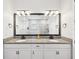 Bathroom with dual vanity, granite countertops, modern mirrors, and a bright and airy feel at 6229 Sea Air Dr, Apollo Beach, FL 33572
