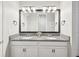 Stylish bathroom featuring double sinks, granite countertops, and modern fixtures at 6229 Sea Air Dr, Apollo Beach, FL 33572