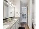 Bathroom featuring double sinks with granite countertops and updated fixtures at 6229 Sea Air Dr, Apollo Beach, FL 33572