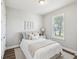 Cozy bedroom with natural light from a window and stylish décor at 6229 Sea Air Dr, Apollo Beach, FL 33572