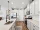 Bright kitchen with white cabinets, stainless steel appliances, and a stylish faucet for modern appeal at 6229 Sea Air Dr, Apollo Beach, FL 33572