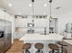 Bright kitchen featuring white cabinetry, modern appliances, and a large island with barstool seating at 6229 Sea Air Dr, Apollo Beach, FL 33572