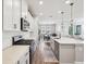 Well-equipped kitchen with stainless steel appliances, white countertops, and an open layout to the living areas at 6229 Sea Air Dr, Apollo Beach, FL 33572