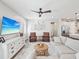 Comfortable living room with modern decor, leather chairs, and an open layout that flows into the kitchen at 6229 Sea Air Dr, Apollo Beach, FL 33572