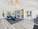 Elegant clubhouse lobby with modern light fixtures, comfortable blue couches, and stylish decor, creating a welcoming ambiance at 6229 Sea Air Dr, Apollo Beach, FL 33572