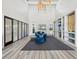 Expansive clubhouse lobby with high ceilings, modern decor, stylish seating, and elegant lighting features at 6229 Sea Air Dr, Apollo Beach, FL 33572