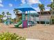 Playground with slides, climbing structures, and shaded seating areas near community center at 6229 Sea Air Dr, Apollo Beach, FL 33572