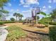 Community playground equipment including slides, swings, and climbing features on a bed of mulch at 6229 Sea Air Dr, Apollo Beach, FL 33572