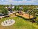 Community playground with swings, slides, and climbing structures surrounded by lush green space and landscaping at 6229 Sea Air Dr, Apollo Beach, FL 33572