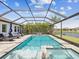 Relaxing pool and spa area with screened enclosure, perfect for enjoying the Florida sunshine at 6229 Sea Air Dr, Apollo Beach, FL 33572