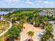 Aerial view of a colorful splash pad, lounge chairs, and landscaping in the community at 6229 Sea Air Dr, Apollo Beach, FL 33572