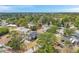 Aerial view of a suburban neighborhood showcasing lush greenery and various home styles at 6246 Arthur Ave, New Port Richey, FL 34653