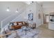 Bright living room featuring a high ceiling, modern decor, and hardwood floors at 6246 Arthur Ave, New Port Richey, FL 34653