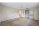 Bedroom featuring a neutral decor, carpeted floors, a closet with mirrored doors and an adjoining bathroom at 6340 Hillview Rd, Spring Hill, FL 34606
