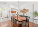 Inviting dining room showcasing hardwood floors, a chandelier, and a large table perfect for gatherings at 635 Painted Leaf Dr, Brooksville, FL 34604