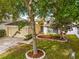 Lovely home with mature tree in the yard, well-manicured landscaping, and a welcoming entrance at 635 Painted Leaf Dr, Brooksville, FL 34604